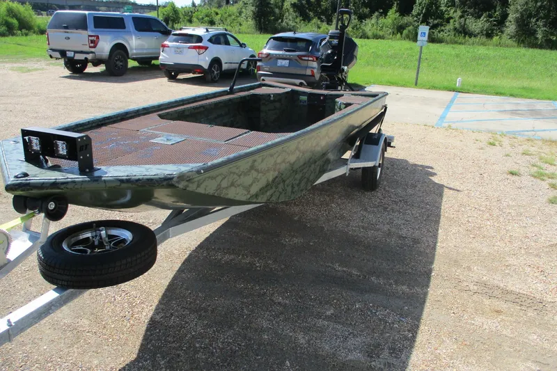Slide: The Image of 2026 Gator Tail 1854 Extreme boat on trailer in parking lot. - 2