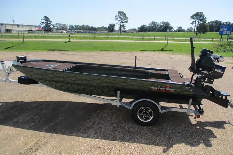 Slide: The Image of 2026 Gator Tail 1854 Extreme boat on trailer, parked outdoors. - 3