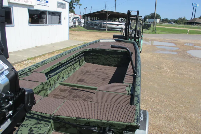 Slide: The Image of 2026 Gator Tail 1854 Extreme boat with camouflage design, parked outdoors. - 5