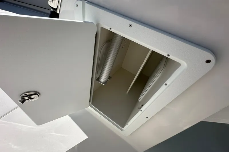 Slide: The Image of Open storage compartment on 2026 Sea Pro 240 Dual Console boat. - 10
