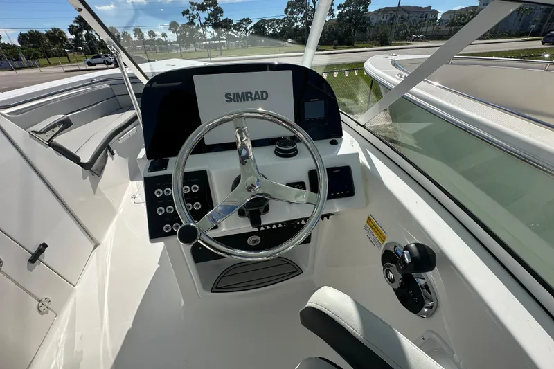 Slide: The Image of 2026 Sea Pro 240 Dual Console boat helm with Simrad navigation system. - 4