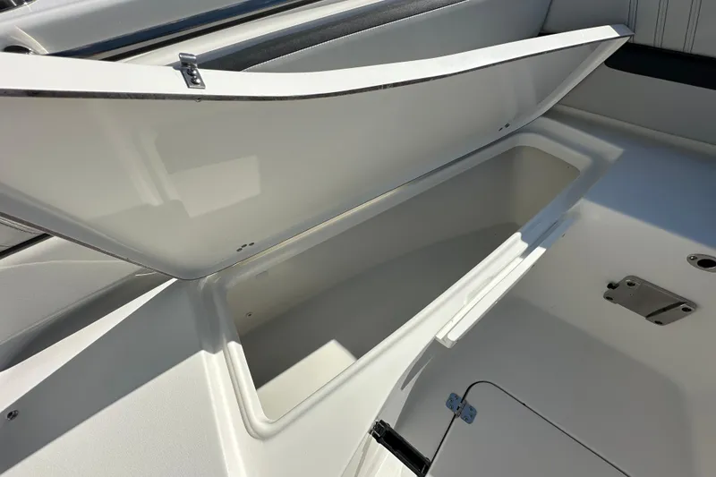Slide: The Image of Open storage compartment on 2026 Sea Pro 240 Dual Console boat. - 7