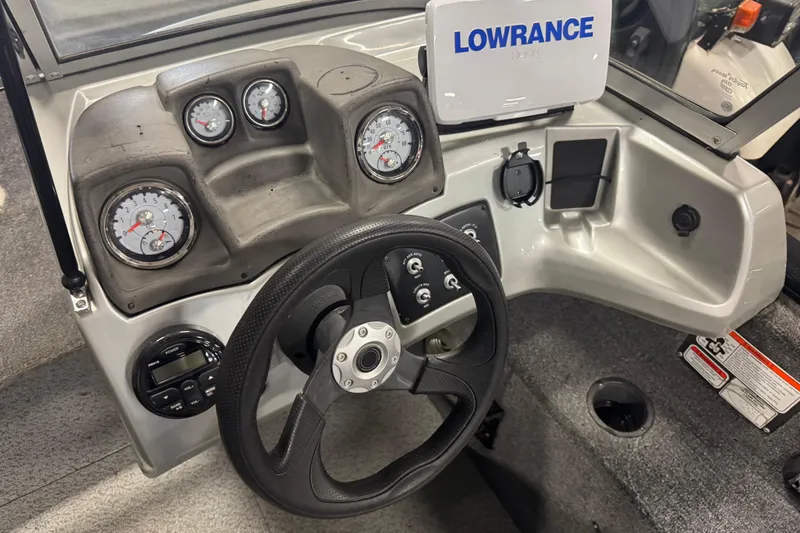Slide: The Image of 2017 Tracker Pro Guide V-175 Combo dashboard with steering wheel and Lowrance electronics. - 11