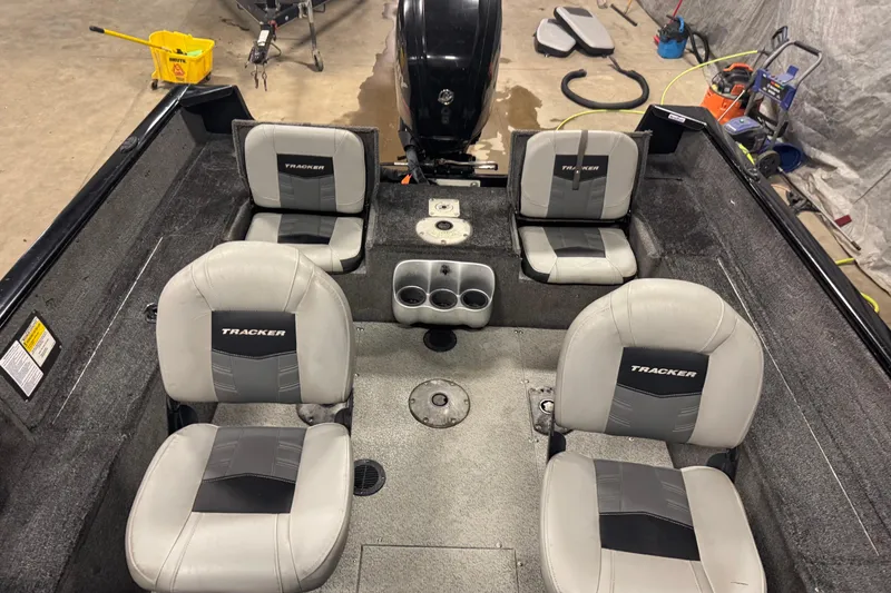 Slide: The Image of 2017 Tracker Pro Guide V-175 Combo boat interior with four seats and cup holders. - 17