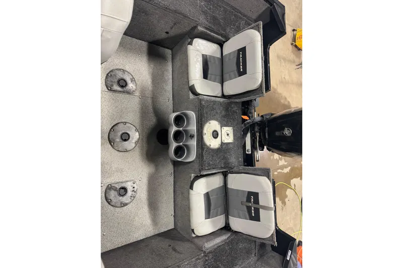 Slide: The Image of 2017 Tracker Pro Guide V-175 Combo boat interior with seating and cup holders. - 7