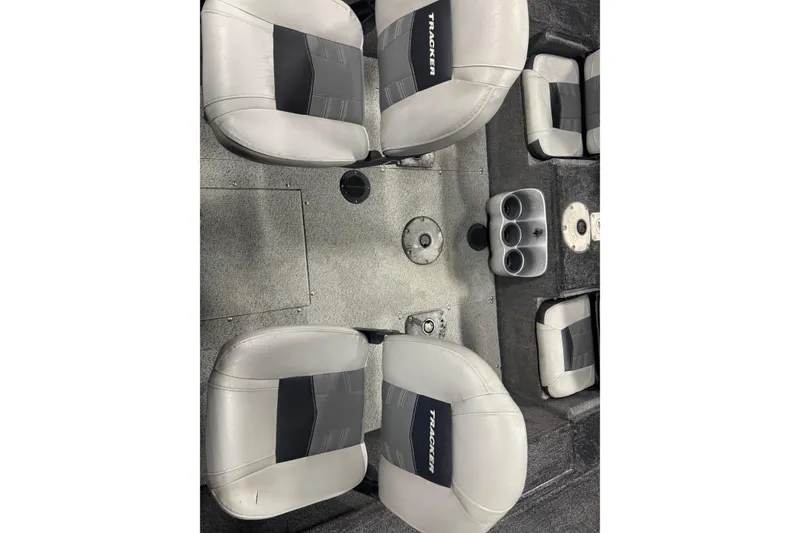 Slide: The Image of 2017 Tracker Pro Guide V-175 Combo boat interior with gray seating and cup holders. - 8