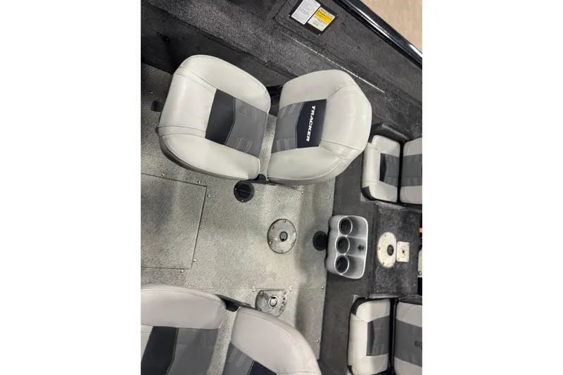 Slide: The Image of 2017 Tracker Pro Guide V-175 Combo boat interior with gray seating and cup holders. - 9