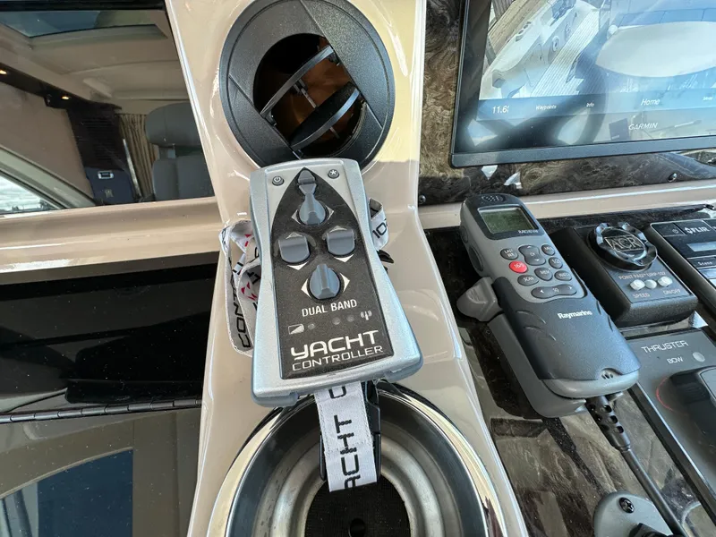 Slide: The Image of Control panel of a 2009 Sea Ray 60 Sundancer with yacht controller and navigation equipment. - 12