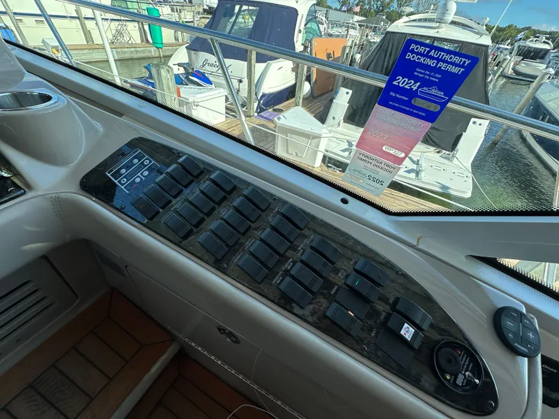 Slide: The Image of Control panel of a 2009 Sea Ray 60 Sundancer yacht with docking permit visible. - 14
