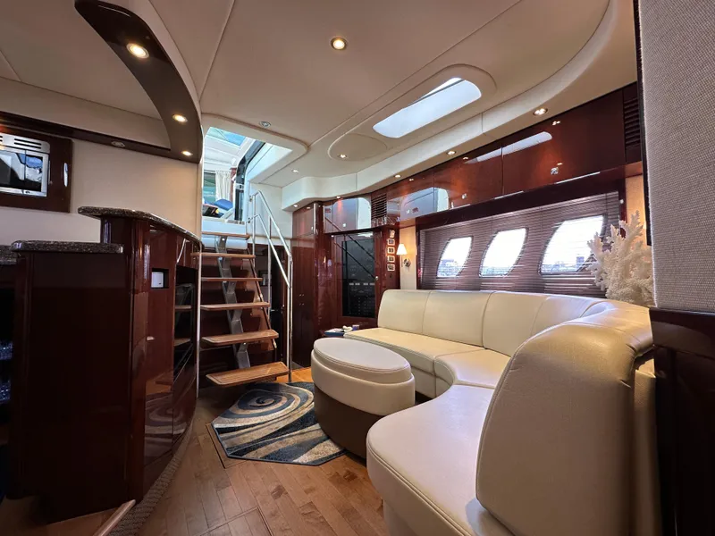 Slide: The Image of Luxurious interior of 2009 Sea Ray 60 Sundancer yacht with elegant seating and wooden accents. - 16