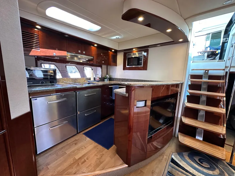 Slide: The Image of Luxurious kitchen interior of 2009 Sea Ray 60 Sundancer yacht with modern appliances. - 17