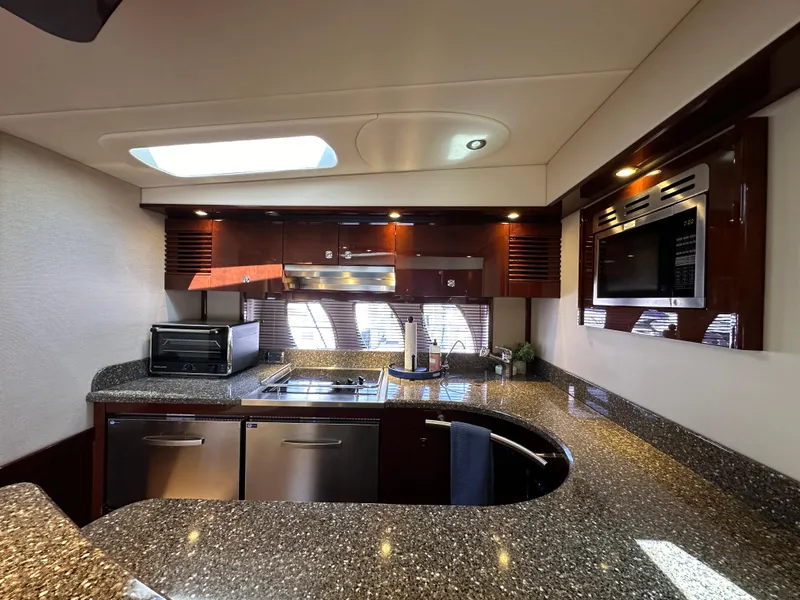 Slide: The Image of Luxurious kitchen interior of 2009 Sea Ray 60 Sundancer yacht with modern appliances. - 18