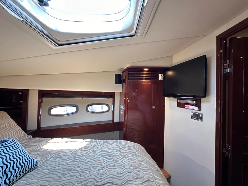 Slide: The Image of Luxurious cabin interior of 2009 Sea Ray 60 Sundancer yacht with skylight and TV. - 30