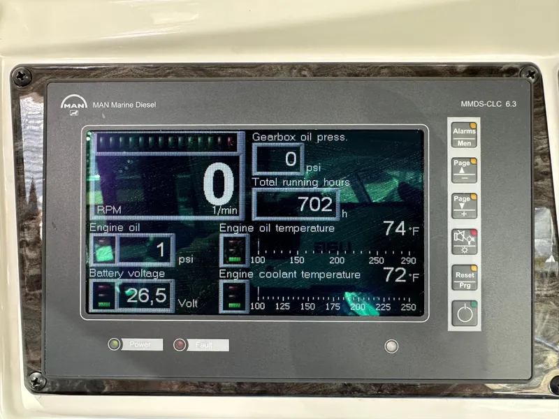 Slide: The Image of Control panel of a 2009 Sea Ray 60 Sundancer displaying engine metrics and alerts. - 35