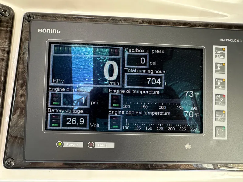 Slide: The Image of Digital display panel on a 2009 Sea Ray 60 Sundancer showing engine metrics and battery voltage. - 36