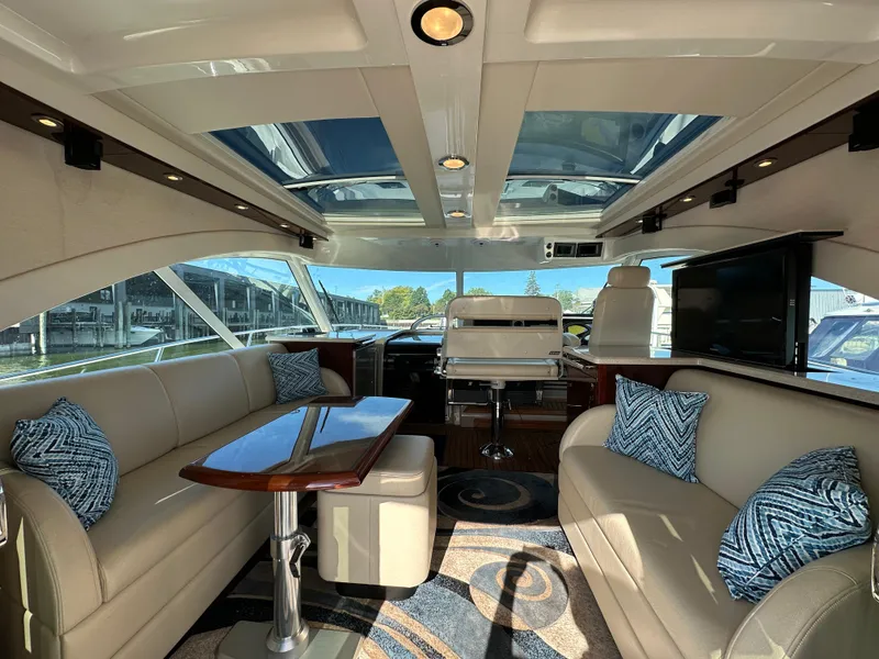 Slide: The Image of Luxurious interior of 2009 Sea Ray 60 Sundancer yacht with plush seating and elegant design. - 4