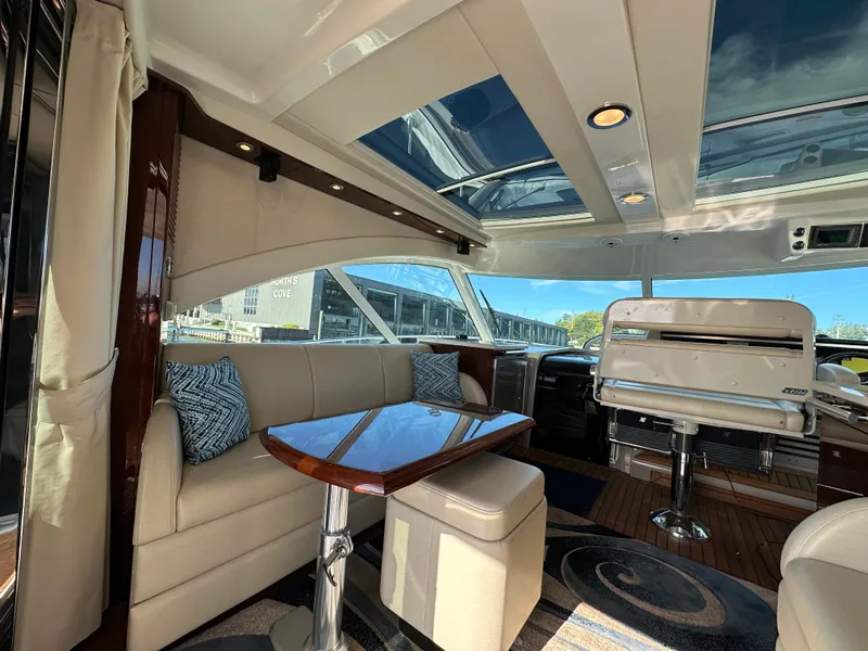 Slide: The Image of Luxurious interior of 2009 Sea Ray 60 Sundancer yacht with plush seating and skylight. - 5