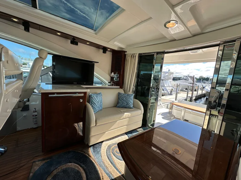 Slide: The Image of Luxurious interior of 2009 Sea Ray 60 Sundancer yacht with plush seating and modern amenities. - 7