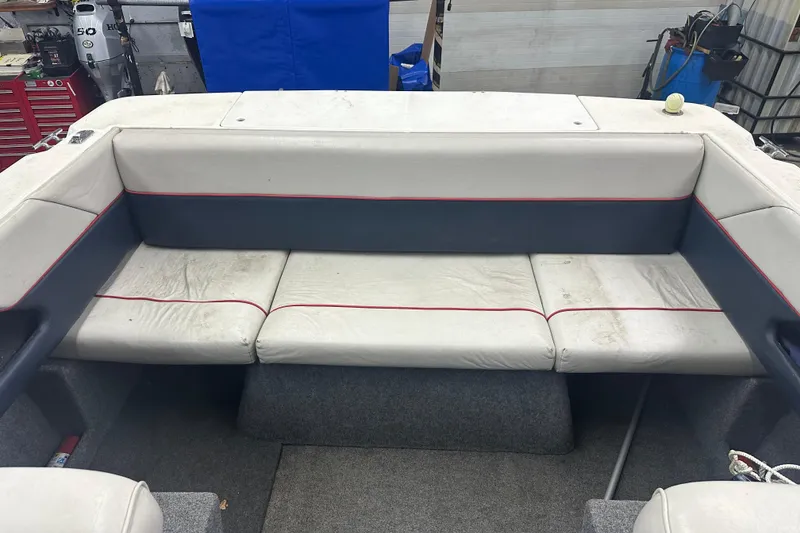 Slide: The Image of 1992 Bayliner 2252 Ciera Classic boat interior with white and gray seating. - 6