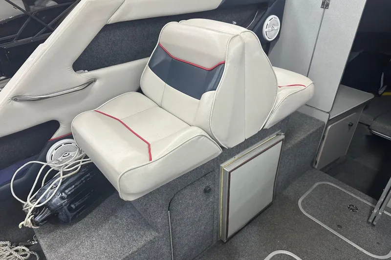 Slide: The Image of Interior of 1992 Bayliner 2252 Ciera Classic boat with white seating and storage. - 9