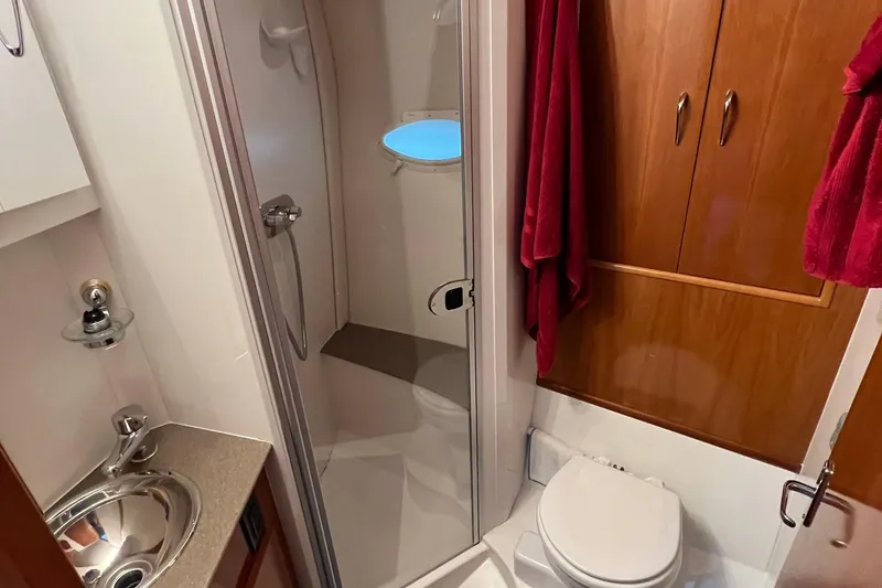 Slide: The Image of Helm of 2005 Carver 33 Super Sport with Raymarine navigation system and gauges. - 10