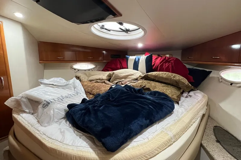 Slide: The Image of Interior of 2005 Carver 33 Super Sport yacht with TV, fan, and refrigerator. - 12