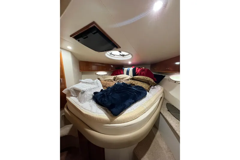 Slide: The Image of Interior cabin of 2005 Carver 33 Super Sport yacht with cozy bedding. - 17