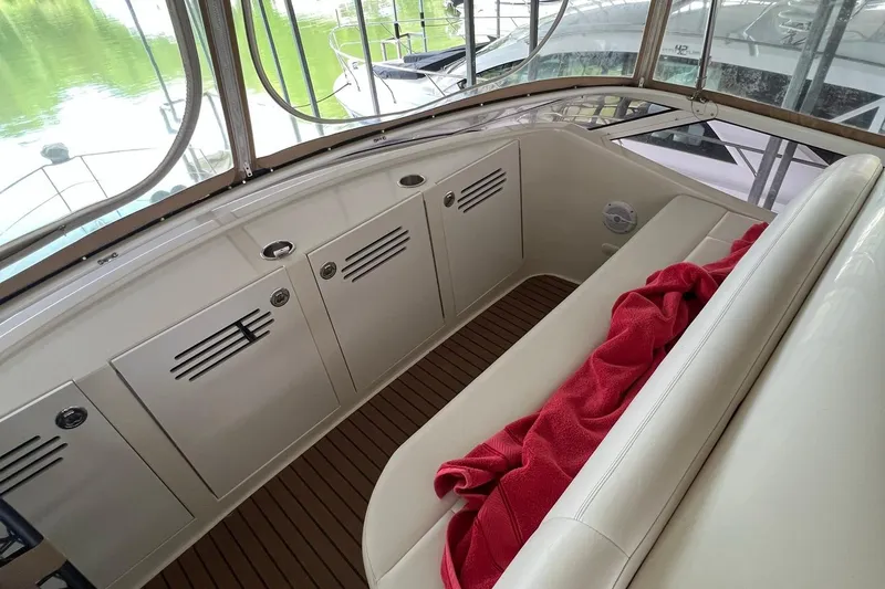 Slide: The Image of 2005 Carver 33 Super Sport boat interior with helm and seating area. - 3