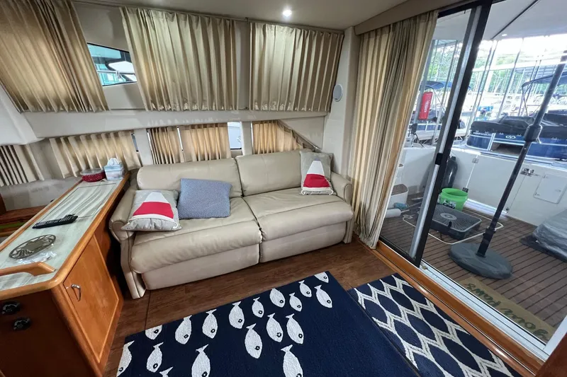 Slide: The Image of Interior view of 2005 Carver 33 Super Sport yacht with wooden steps and railing. - 7