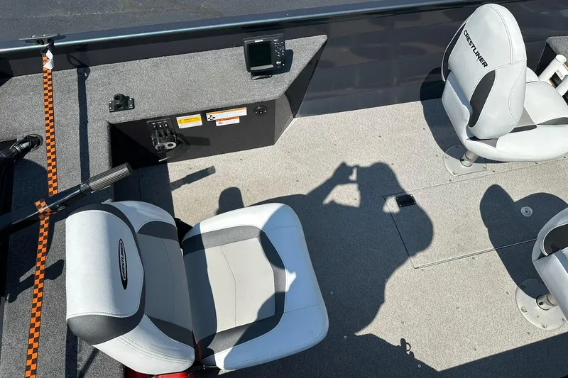 Slide: The Image of 2013 Crestliner 16 Kodiak boat interior with seats and control panel. - 10