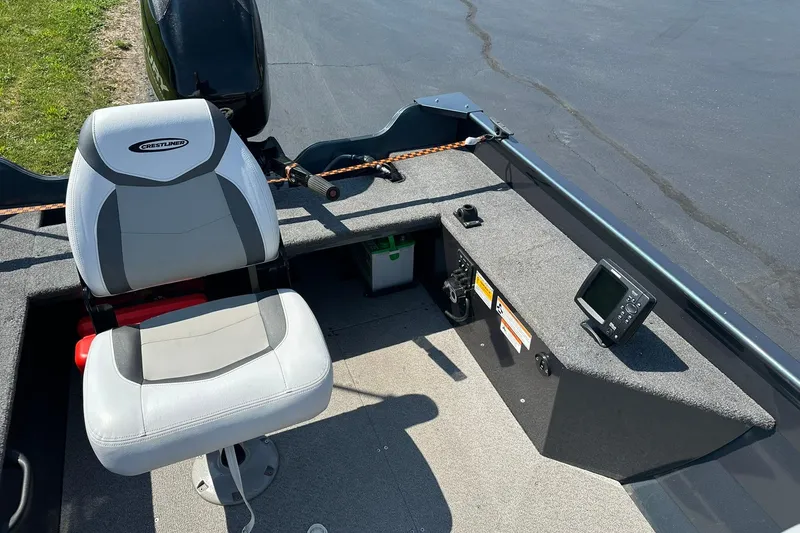 Slide: The Image of 2013 Crestliner 16 Kodiak boat interior with seat and control panel. - 11