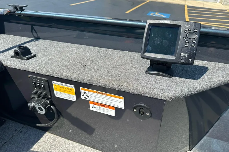 Slide: The Image of 2013 Crestliner 16 Kodiak boat dashboard with fish finder and control panel. - 12