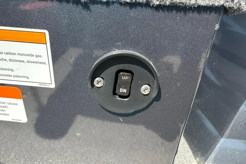 Slide: The Image of Switch panel on 2013 Crestliner 16 Kodiak boat with warning labels. - 13