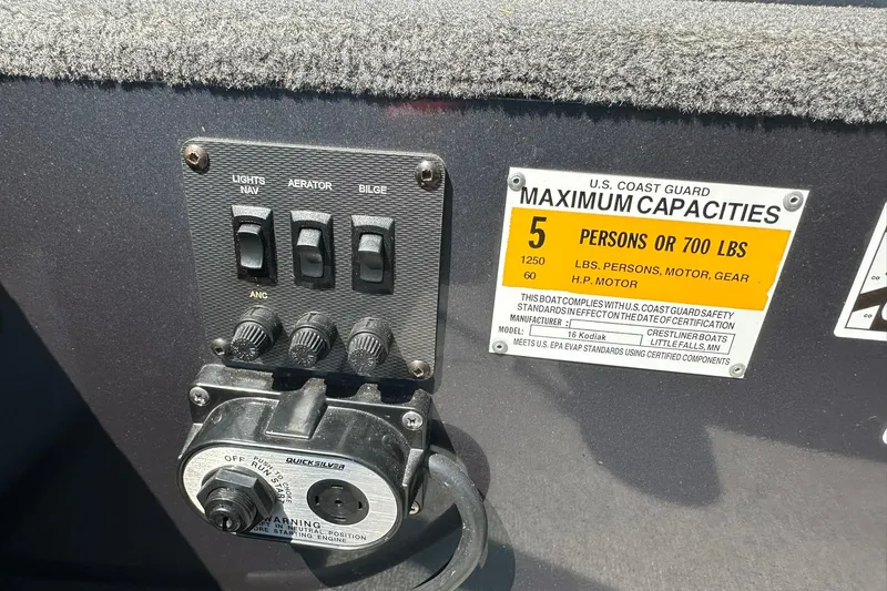 Slide: The Image of Control panel and capacity label on 2013 Crestliner 16 Kodiak boat. - 14