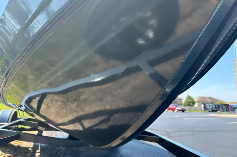 Slide: The Image of 2013 Crestliner 16 Kodiak boat hull on trailer, close-up view. - 29