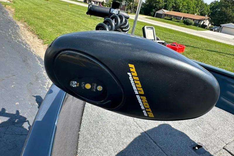 Slide: The Image of Minn Kota PowerDrive V2 motor on 2013 Crestliner 16 Kodiak boat, parked outdoors. - 30