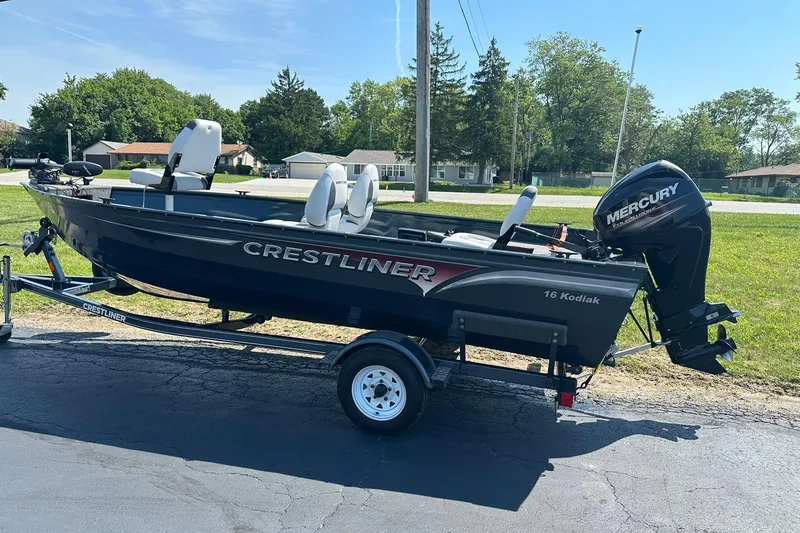 Slide: The Image of 2013 Crestliner 16 Kodiak boat on trailer with Mercury outboard motor. - 4