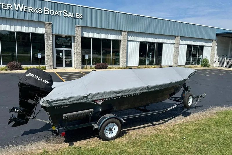 Slide: The Image of 2013 Crestliner 16 Kodiak boat with cover, parked outside Water Werks Boat Sales. - 5