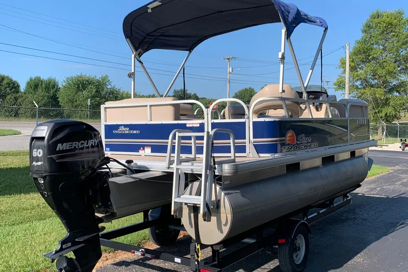 Slide: The Image of 2014 SUNTRACKER PARTY BARGE 18 pontoon boat with Mercury 60 engine on trailer. - 4