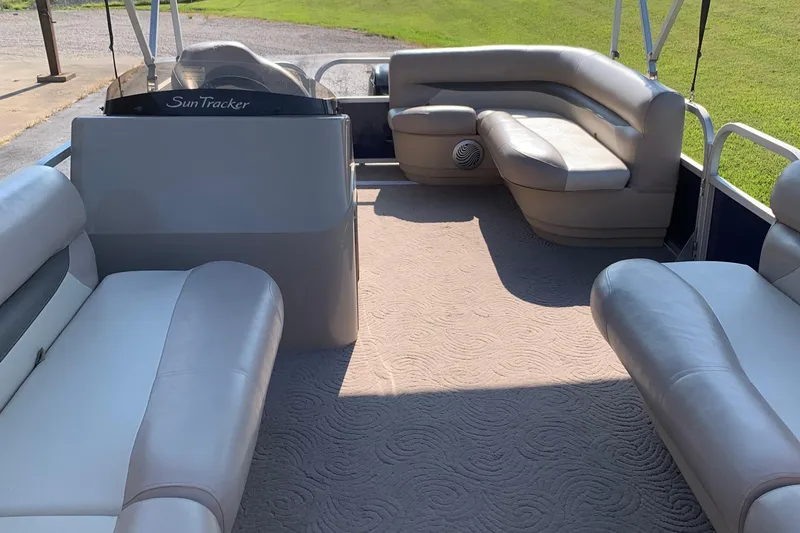Slide: The Image of 2014 SUNTRACKER PARTY BARGE 18 interior with plush seating and spacious layout. - 5