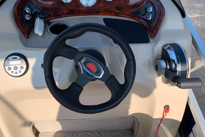 Slide: The Image of Steering console of 2014 SUNTRACKER PARTY BARGE 18 with controls and gauges. - 8