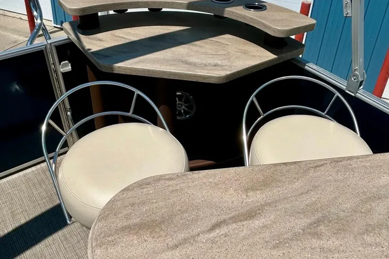 Slide: The Image of Interior of 2017 Starcraft CX 23 RE pontoon boat with seating and table. - 15