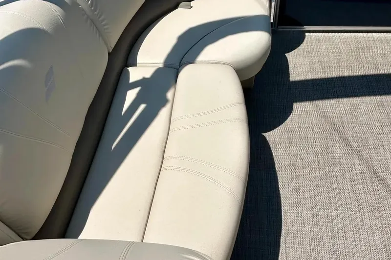 Slide: The Image of Luxurious seating on 2017 Starcraft CX 23 RE boat, featuring elegant beige upholstery. - 17