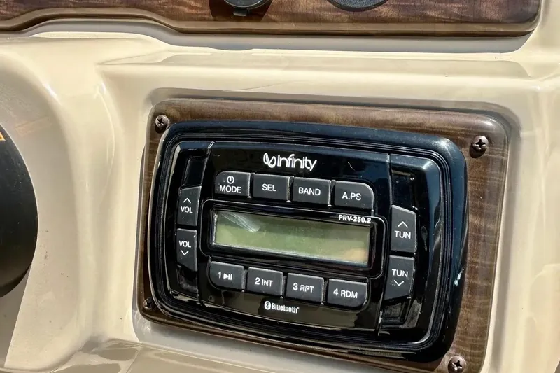 Slide: The Image of Infinity stereo system on 2017 Starcraft CX 23 RE boat dashboard. - 23