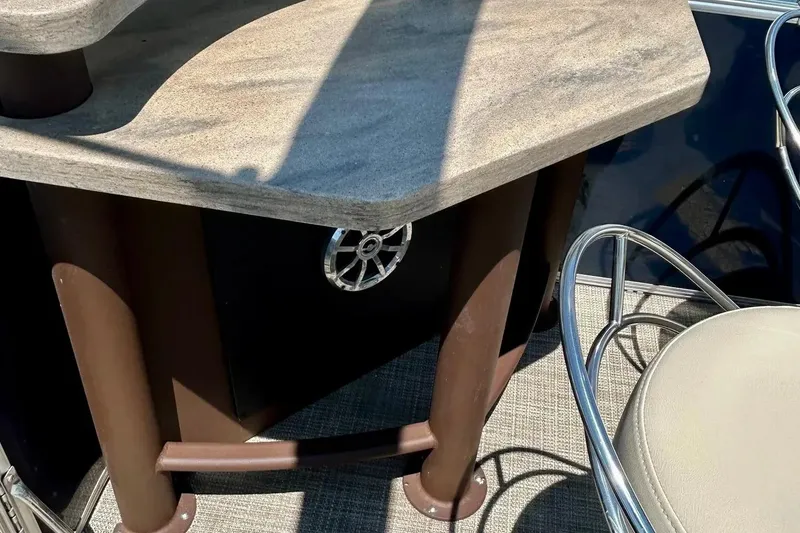 Slide: The Image of 2017 Starcraft CX 23 RE boat interior with table and chair. - 29