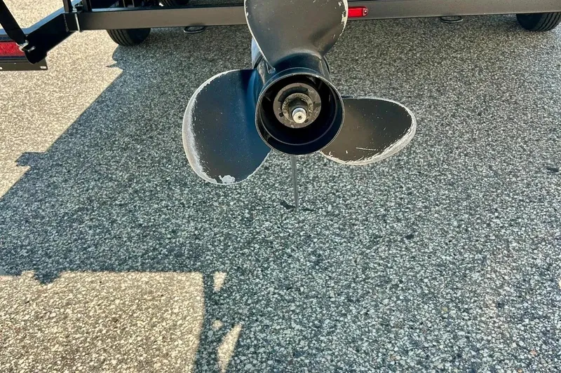 Slide: The Image of 2017 Starcraft CX 23 RE boat propeller on asphalt surface. - 34