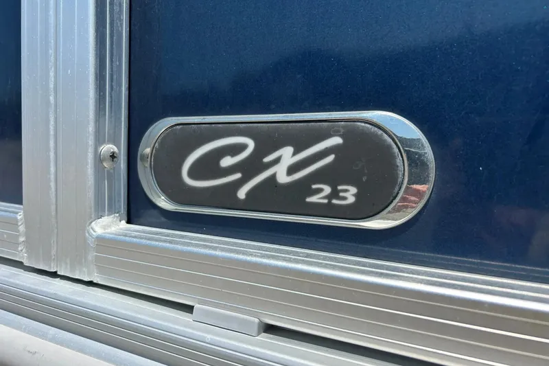 Slide: The Image of 2017 Starcraft CX 23 RE boat emblem on blue background. - 5