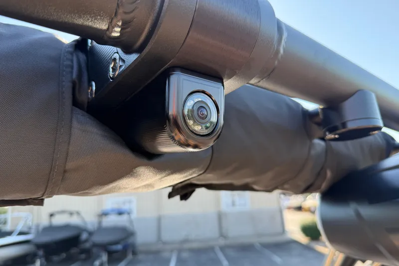 Slide: The Image of Close-up of a 2025 MasterCraft XT24 boat camera mounted on a metal frame. - 15