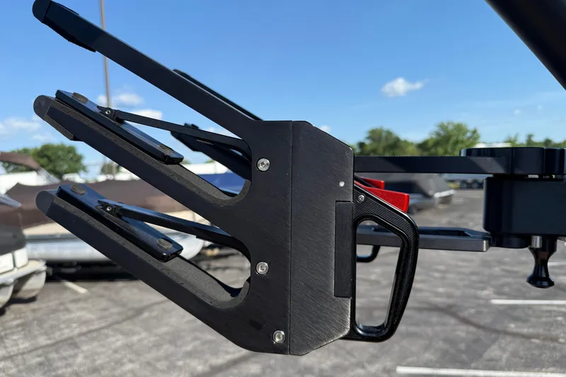 Slide: The Image of 2025 MasterCraft XT24 boat accessory, close-up view of a black metal component. - 17