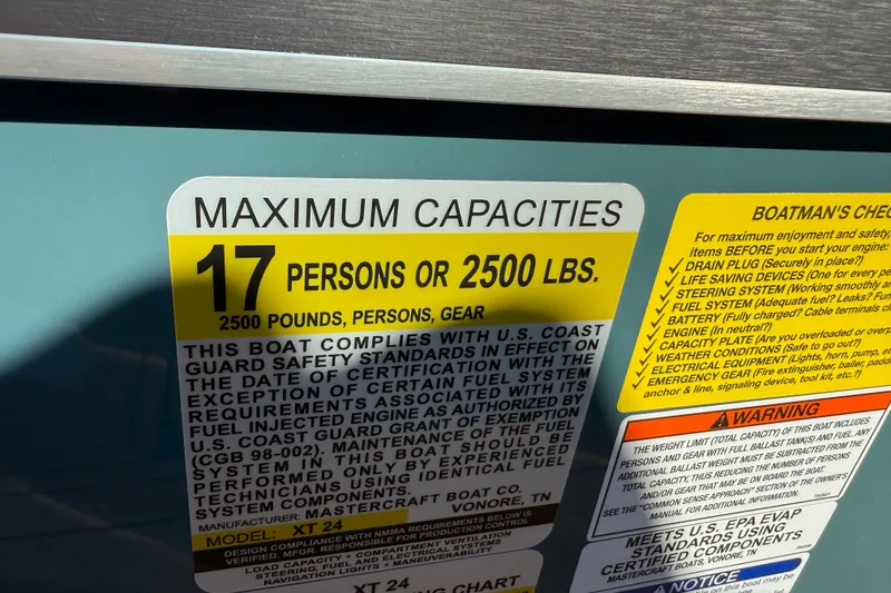 Slide: The Image of 2025 MasterCraft XT24 capacity label: 17 persons or 2500 lbs, safety compliance details. - 27